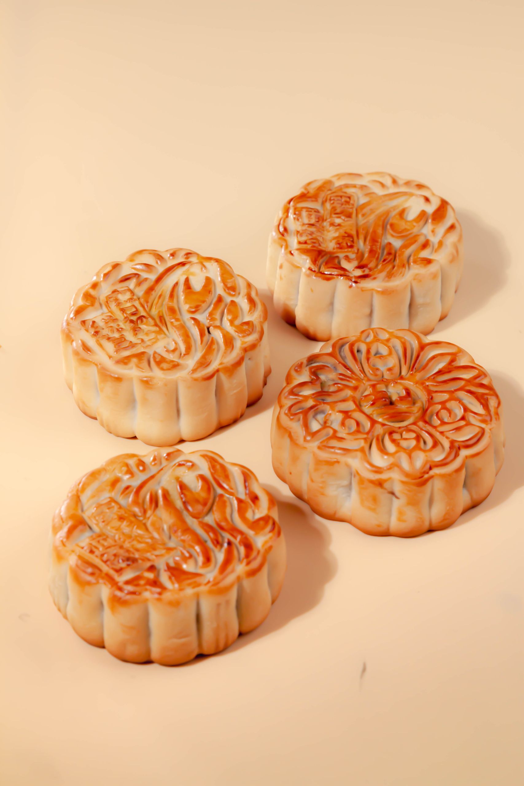 Close-up of traditional mooncakes on a yellow background. Perfect for celebrating the Mid-Autumn Festival.